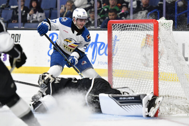 Tristen Nielsen puts the puck past the Reign's Erik Portillo.